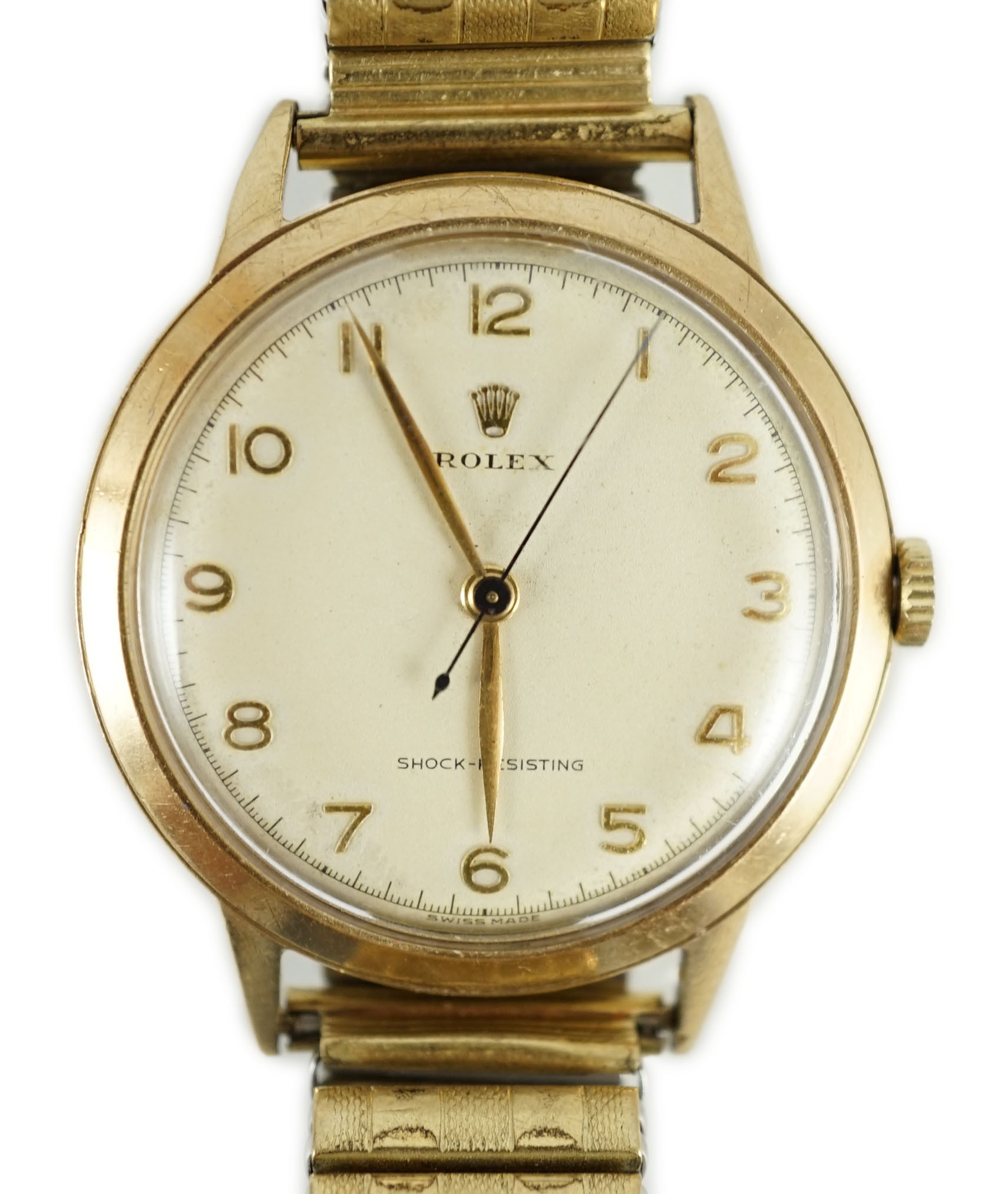 A gentleman's early 1950's 9ct gold Rolex Shock-Resisting manual wind wrist watch, on associated flexible bracelet